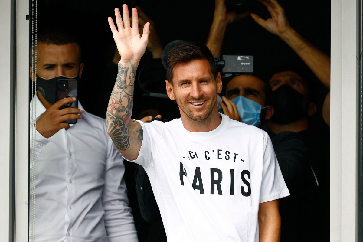 Argentinian footballer Lionel Messi waves at supporters of Paris Saint-Germain upon landing at Le Bourget airport following his departure from Barcelona.PSG is looking forward to complete the 34-year-