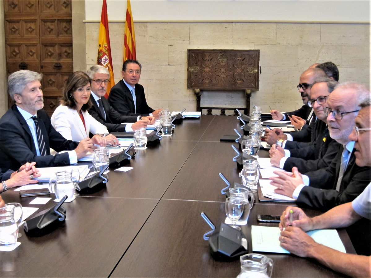 Archivo - La última Junta de Seguridad de Catalunya celebrada en 2018 encabezada por el ministro del Interior, Fernando Grande Marlaska, y el entonces presidente de la Generalitat, Quim Torra. ARCHIV