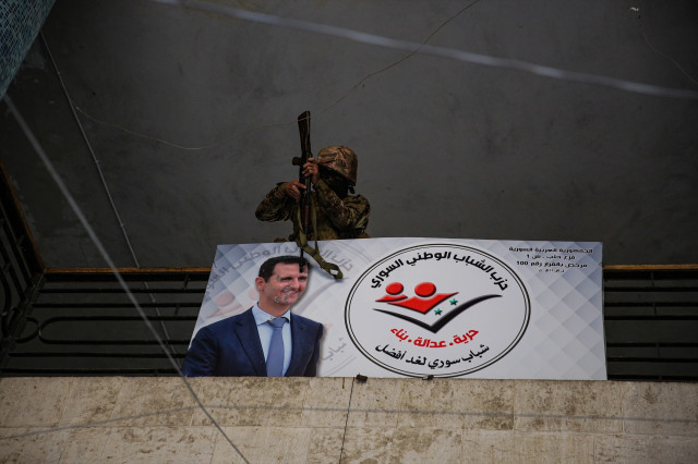 EuropaPress 6392814 december 2024 aleppo syria 01 december 2024 an opposition fighter pointing1