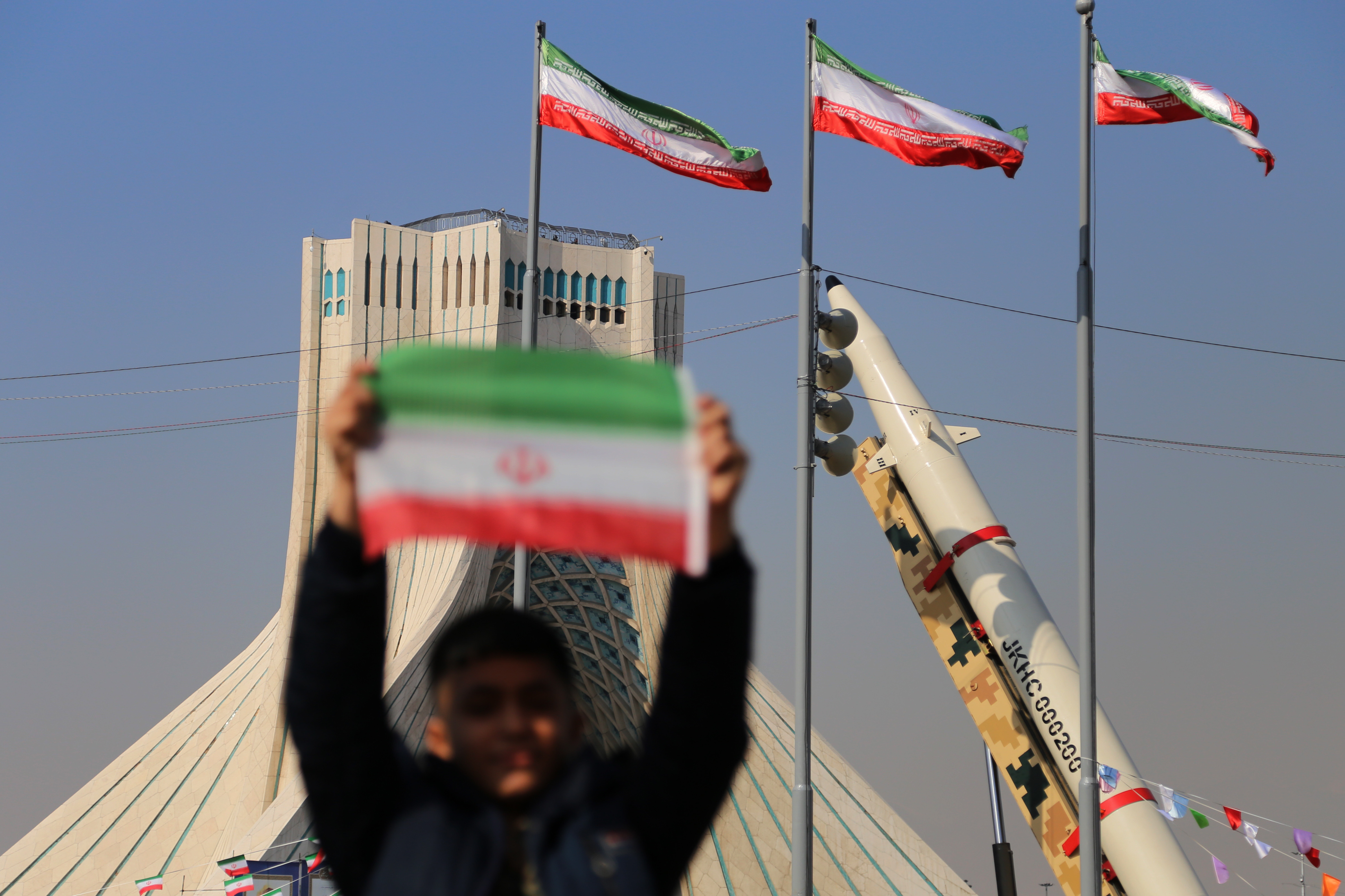 EuropaPress 7417209 february 11 2024 tehran iran an iranian boy holds an iranian flag near the
